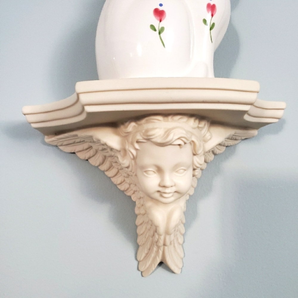 Small decorative cherub shelf